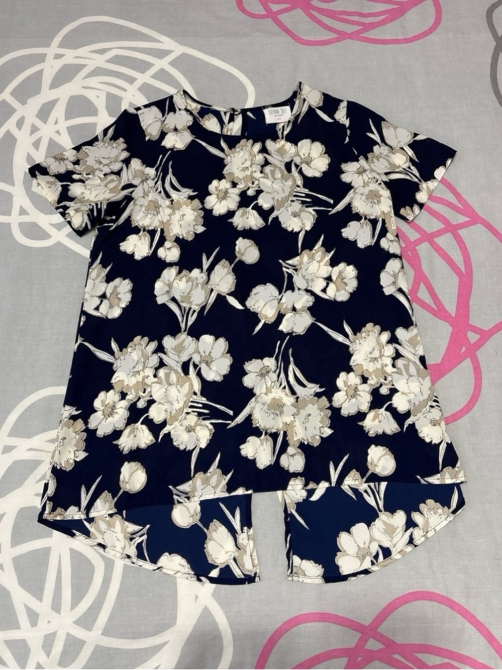 Sienna Sky Navy Blue, White, and Beige Floral Blouse